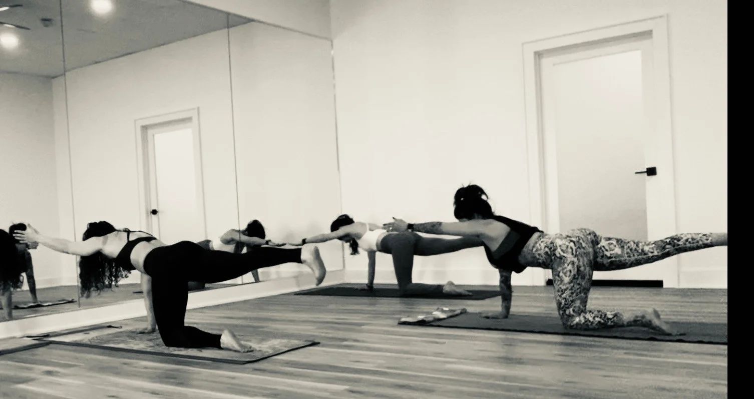 A class in progress in the Lotus Hot Yoga practice room